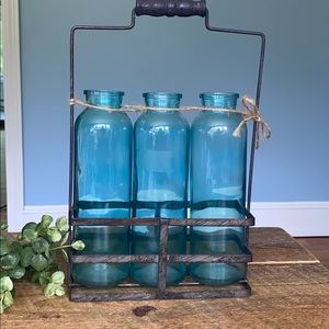 Three vase flower of faux flower holder.